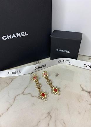 Брендові сережки золотого кольору з дрібними каменями