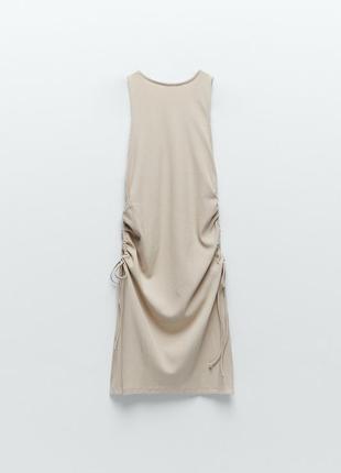 Туніка у рубчик гарного бежевого кольору, з розрізами та на кулісках