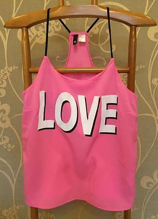 Очень красивая брендовая блузка-маечка ярко-розового цвета.