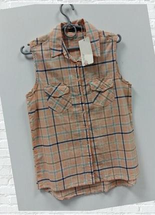 Безрукавка в клітку