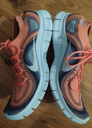 Бігові кросівки унісекс модель nike flycnit free run3 фото