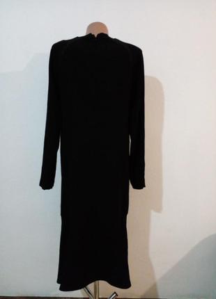 Гарнюча елегантна міді сукня з воланом4 фото