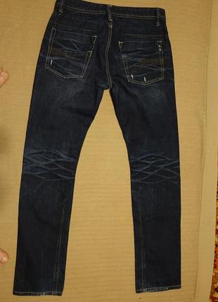 Вузькі сині фірмові джинси з выбеленностями і вытертостями smog німеччина 32/32 р.8 фото
