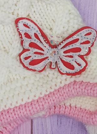 Белая вязанная шапка для девочек ,зимняя с тремя бубонами. "бабочка" р 48-502 фото