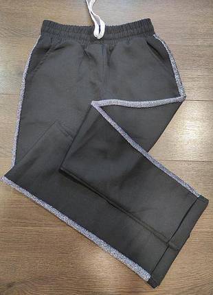 Штани з серебристими вставками