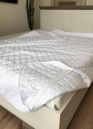 Наматрацник на ліжко з резинками по краях 80*200 см2 фото