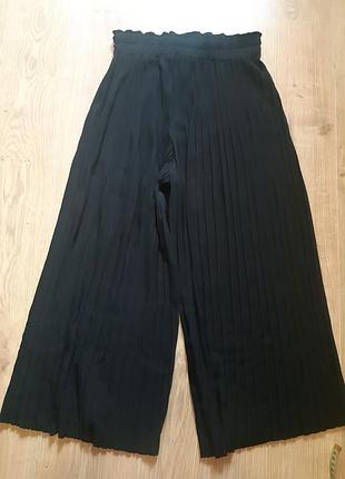 Колюты ,плесированые.штаны укороченные.