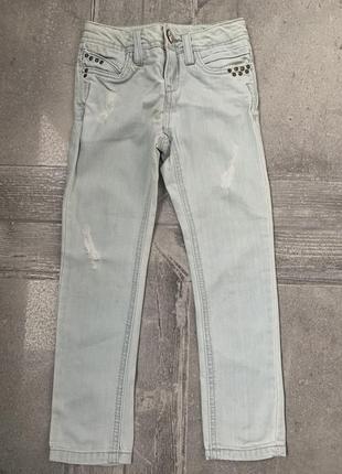 Стильні рвані джинси з кльопами, штани