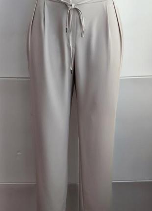 Стильные брюки zara с боковыми карманами1 фото