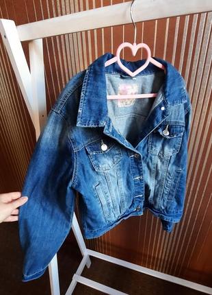 Джинсовці,джинсова куртка з потертостями1 фото