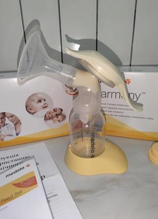 Новий механічний молоковідсмоктувач medela harmony +накладки avent вподарок2 фото