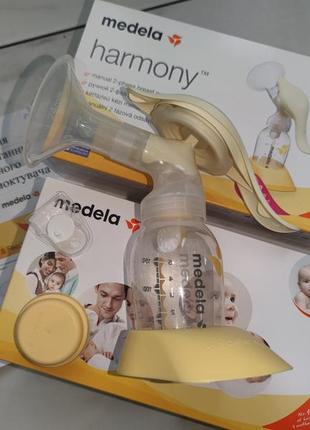 Новий механічний молоковідсмоктувач medela harmony +накладки avent вподарок6 фото