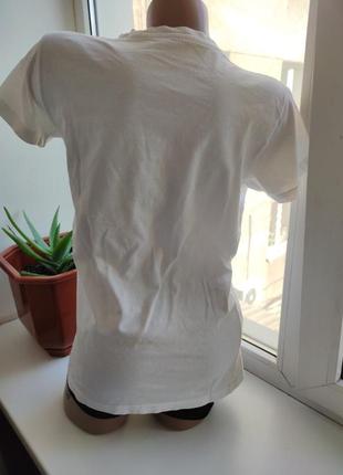 Жіноча біла футболка з написом legend10 фото