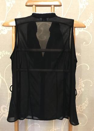 Очень красивая и стильная брендовая блузка чёрного цвета с рюшами 20.2 фото