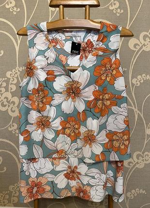 Дуже гарна і стильна брендовий блузка в кольорах.