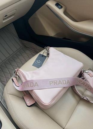 Трендова пудрова рожева жіноча сумочка в стилі prada re-edition light pink женская розовая пудра нейлоновая сумка бренд новинка5 фото