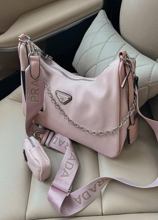 Трендова пудрова рожева жіноча сумочка в стилі prada re-edition light pink женская розовая пудра нейлоновая сумка бренд новинка9 фото