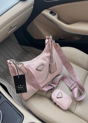 Трендова пудрова рожева жіноча сумочка в стилі prada re-edition light pink жіноча рожева пудра нейлонова сумка бренд новинка3 фото