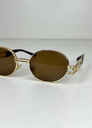 Солнцезащитные очки унисекс коричневые  овал2 фото