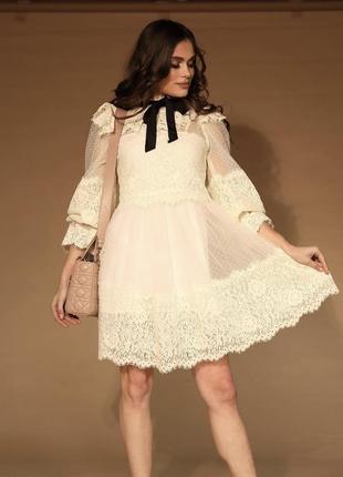 Біла мереживна сукня з об’ємними рукавами2 фото