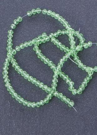Бусины "рондель" хрустальные на нитке (стекло) прозрачное цвет зеленый светлый l -37см d-3-4мм1 фото
