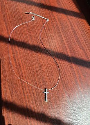 Крестик на невидимой нити