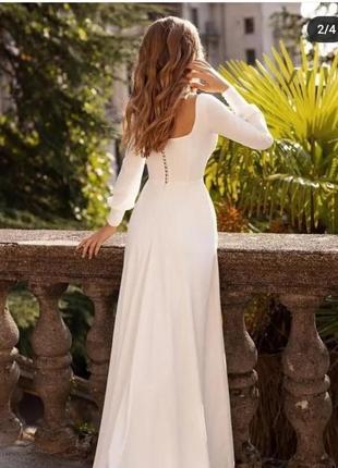 Красива біла сукня з гудзиками на спинці2 фото