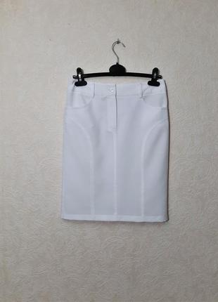 Гарна спідниця біла з кишенями зі шліцею пряма міді середня довжина жіноча3 фото