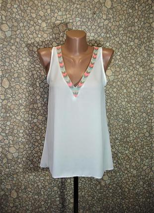 Біла блуза без рукавів з подовженою спинкою "avant-premiere"