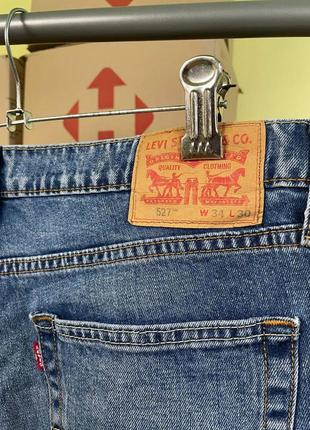 Чоловічі сині джинси levis 5275 фото