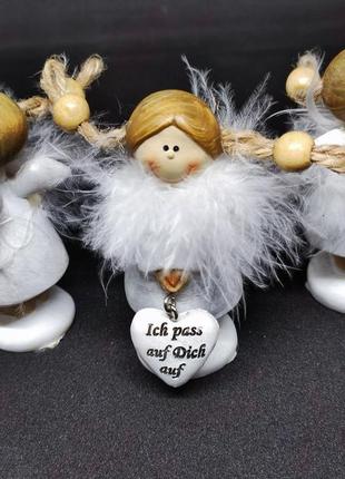 Інтер'єрна лялечка в пір'ї з сердечком. німеччина.7 фото