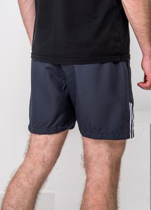 Чоловічі сині спортивні шорти adidas з плащівки з сіткою2 фото