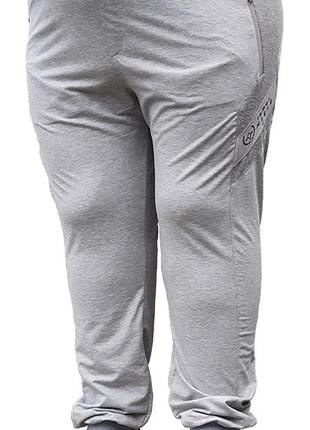 Больших размеров мужские спортивные брюки на манжетах.1 фото