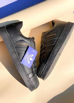 Новые женские и мужские полностью черные кеды adidas superstar all black2 фото