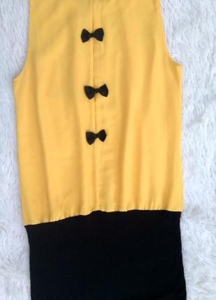 Желтое платье-туника со свободным верхом и узкой черной юбкой h&m германия