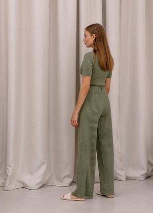 Вязаный брючный костюм с кроп топом и штанами на шнурке4 фото