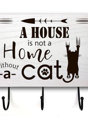 Вхідна табличка з гачкаим "a house is not a home" у 3 кольорах