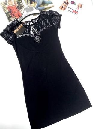 Интересное  короткое черное трикотажное платье1 фото