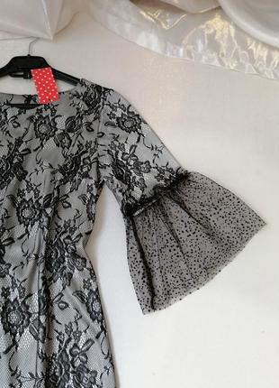 Сукня з стрейчевой тканини з ефектом гіпюру широким воланом на рукавах з ніжної сітки фатиновой4 фото