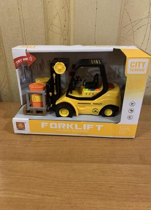 Машина навантажувач.