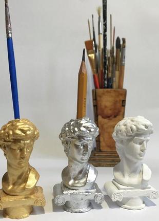 Голова гіпс давид, свічки тіло