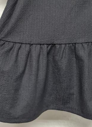 Стильна чорна блуза зі спущенними плечима6 фото