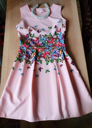 Яскрава літня сукня з метеликами1 фото