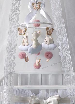 Музичний мобіль в дитяче ліжечко