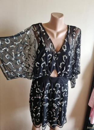 Комбинезон  чёрный  паетки