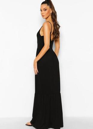 Трикотажна довга сукня чорного кольору на брительках2 фото