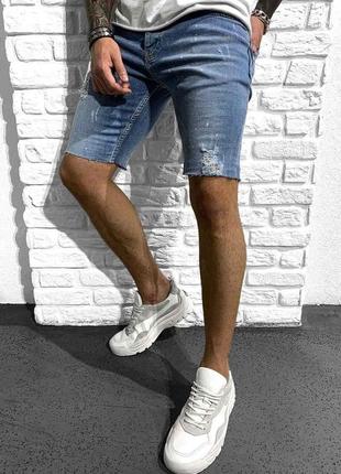 Эффектные джинсовые шорты с потертостями приталенные1 фото