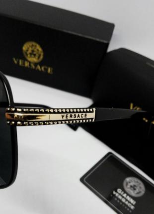 Versace стильные мужские солнцезащитные очки черные с золотом10 фото