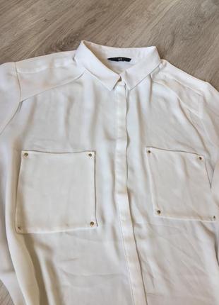 Біла напівпрозора шифонова блуза,з незвичайними деталями крою2 фото