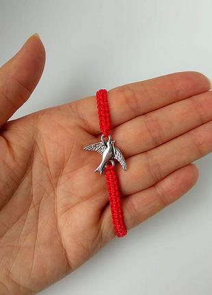 Браслет на руку червона нитка ластівка пташка